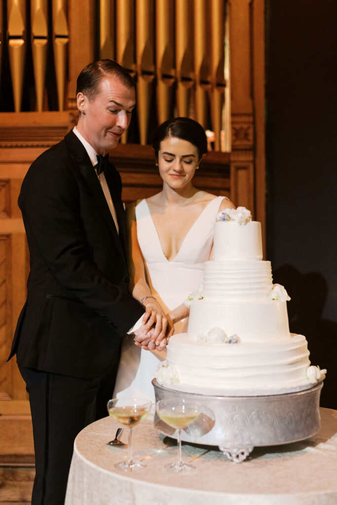 Bride and groom cutting the cake