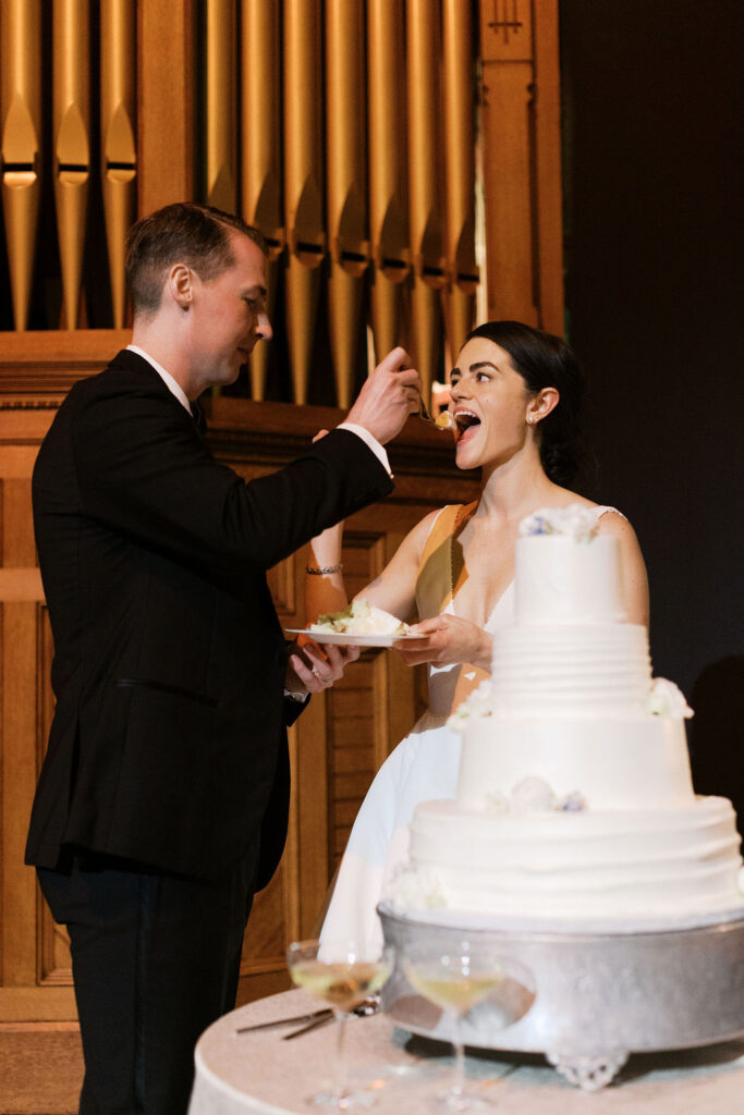 Bride and groom cutting the cake